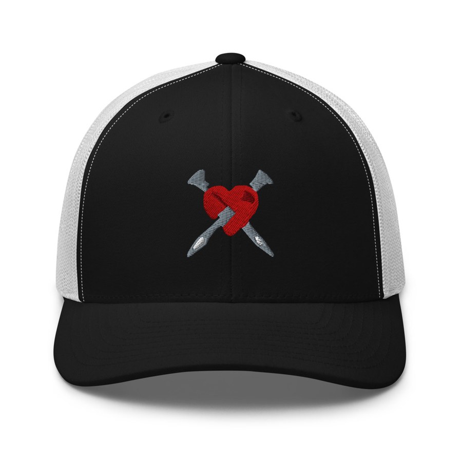 Black and white trucker hat with the red ELLINAS heart and nails embroidered on the front
